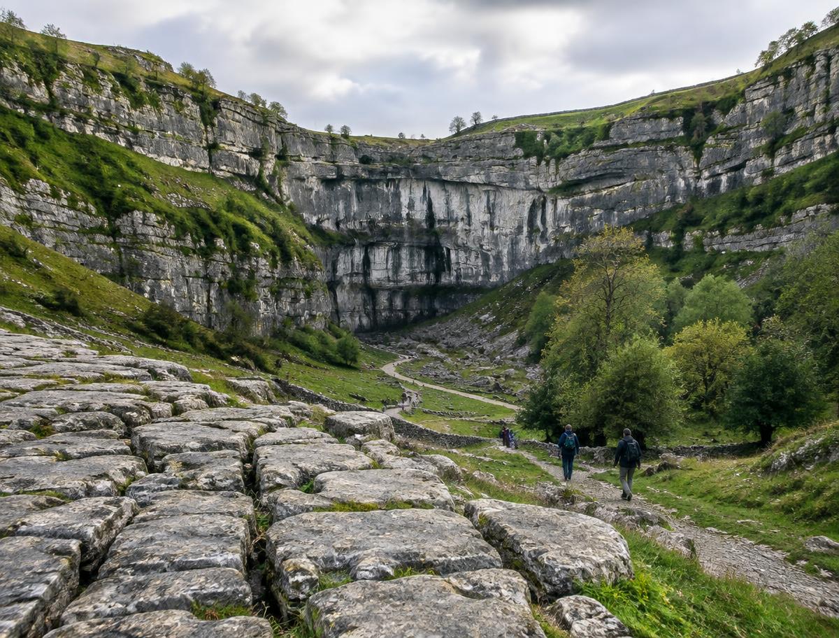 Limestone pavement leading towards the cliff of Malham Cove